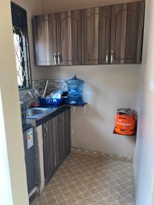 Una cocina o cocineta en Cozy suites 3