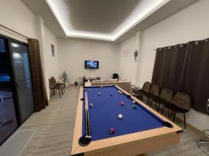 a billiard room with a pool table in it at Plakang pool villa ปลากั้งพูลวิลล่า in Chiang Rai
