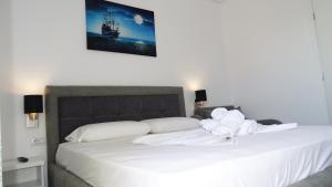 Postel nebo postele na pokoji v ubytování Hotel Keli