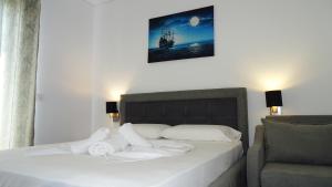Postel nebo postele na pokoji v ubytování Hotel Keli