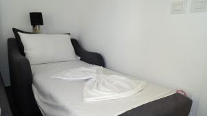 Postel nebo postele na pokoji v ubytování Hotel Keli