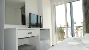 TV a/nebo společenská místnost v ubytování Hotel Keli