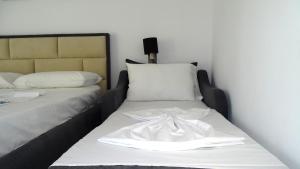 Postel nebo postele na pokoji v ubytování Hotel Keli