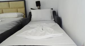 Postel nebo postele na pokoji v ubytování Hotel Keli