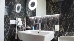 Koupelna v ubytování Hotel Keli
