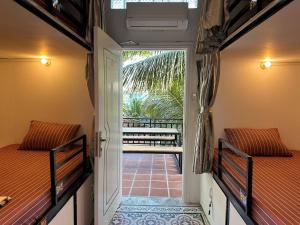 Postel nebo postele na pokoji v ubytování Villa Koh Rong