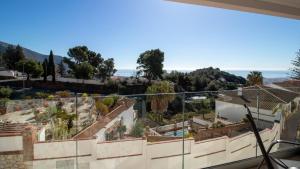 a view from the balcony of a house at Stylish Central Apartment & Panoramic Views Mijas in Mijas
