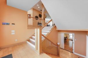 a staircase in a home with a stair case at Coconut Palm House in Captiva