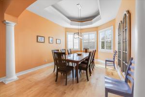 a dining room with a table and chairs at Coconut Palm House in Captiva