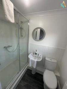 a bathroom with a shower and a toilet and a sink at Overton View in Stockton-on-Tees +29 photos