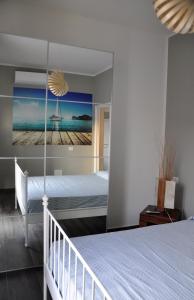 a bedroom with a bed and a painting on the wall at Casa Marzi in Pesaro