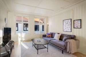 a living room with a couch and a table at The Townhouse Dream I Must See Views! in Bergen