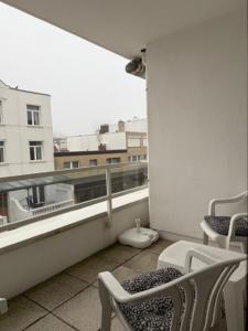a balcony with a view of a building at Ferienwohnungen Alte Schmiede 9 in Norderney