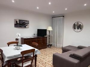a living room with a couch and a table at Casa sulla Rocca in Rocca di Papa
