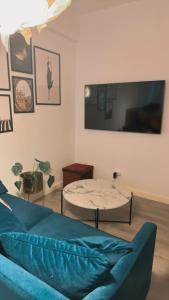 a living room with a couch and a table at Luxury Stay Düsseldorf Altstadt Moments in Düsseldorf