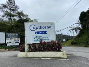a sign for a store on the side of a road at 2B2R at Kae Farm in Brinchang