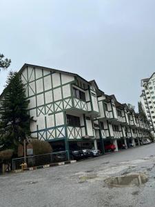 a large building on the side of a street at 2B2R at Kae Farm in Brinchang
