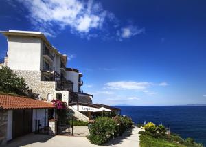 a building with a view of the ocean at Nergis Hotel in Karaburun