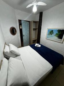 Cama ou camas em um quarto em Pousada Baobá