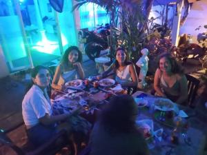 a group of people sitting around a table at Pick Me Village in Dambulla