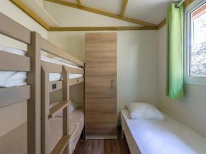 Postel nebo postele na pokoji v ubytování Camping Torraccia
