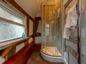 a bathroom with a shower and a window at Pass the Keys Stay in the Original Home of the Gingerbread Man! in Market Drayton +17 photos