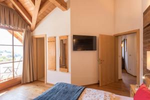 Μια τηλεόραση ή/και κέντρο ψυχαγωγίας στο Apartment Sella - Unterkehrhof
