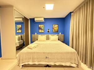 Giường trong phòng chung tại iFlat Brookfield Towers BT3003 - Jardim Goias +16 ảnh