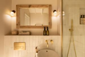 a bathroom with a shower and a sink and a mirror at The Blue Pigeons Hotel and Restaurant in Worth +90 photos