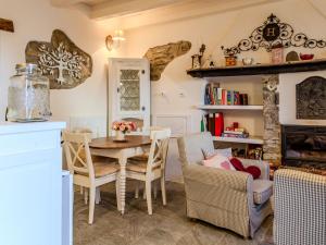 a dining room with a table and chairs at Holiday Home Casetta Rosa by Interhome in San Siro