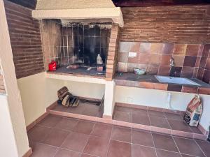 a small bathroom with a sink and a tiled floor at Apartment Las Pergolas-2 by Interhome in Jávea