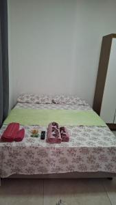 Giường trong phòng chung tại J&m hospedagem