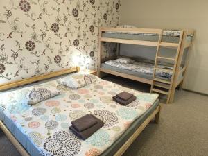 a bedroom with two bunk beds and a ladder at Hotel Katrina in Cēsis +35 photos