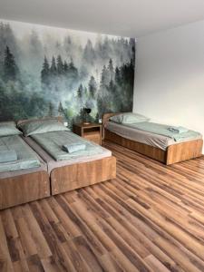 Postel nebo postele na pokoji v ubytování Apartament Zielone Wzgórze