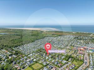 an aerial view of a city with a red sign at Holiday Home Horizon- Sea & Sun by Interhome in Renesse +24 photos