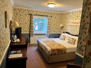 Postel nebo postele na pokoji v ubytování Ramnee Hotel