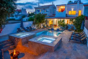 a backyard with a swimming pool and a house at Villa Palancar by Algarve Vacation in Albufeira