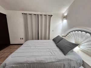 Postel nebo postele na pokoji v ubytování Central Petit Apartment