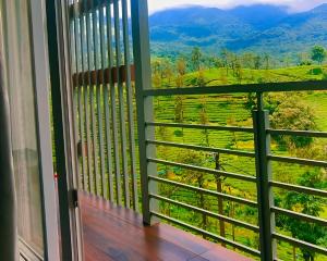 a balcony with a view of the mountains at Hillway Boutique Resort in Vythiri