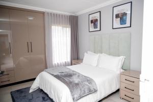 Ένα ή περισσότερα κρεβάτια σε δωμάτιο στο Cottonwoods Apartments +28 φωτογραφίες