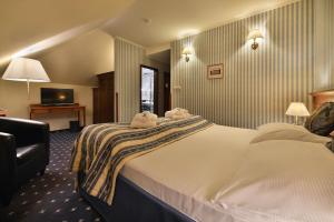 Postel nebo postele na pokoji v ubytování Hotel Morris Relax & Wellness