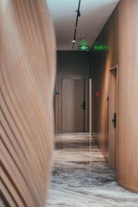 an empty hallway with a door in a building at La Onda Hotel Durres in Durrës