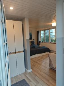Postel nebo postele na pokoji v ubytování Ferienwohnung Diekblick - Kleiner Deichhof