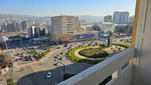 a view of a city street with cars on the road at The birds nest in Tbilisi City