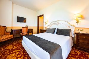 Postel nebo postele na pokoji v ubytování Il Gentiluomo Hotel & SPA
