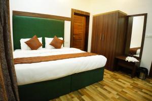 Postel nebo postele na pokoji v ubytování RICHBERRY- A Premium Plantation Villa's