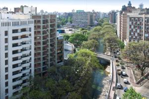 an aerial view of a city with a river and buildings at NH Córdoba Urbano in Córdoba