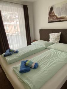 Postel nebo postele na pokoji v ubytování Appartement Silbermond
