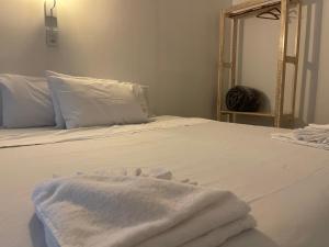 Postel nebo postele na pokoji v ubytování Grand'Hostel