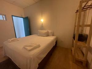 Postel nebo postele na pokoji v ubytování Grand'Hostel
